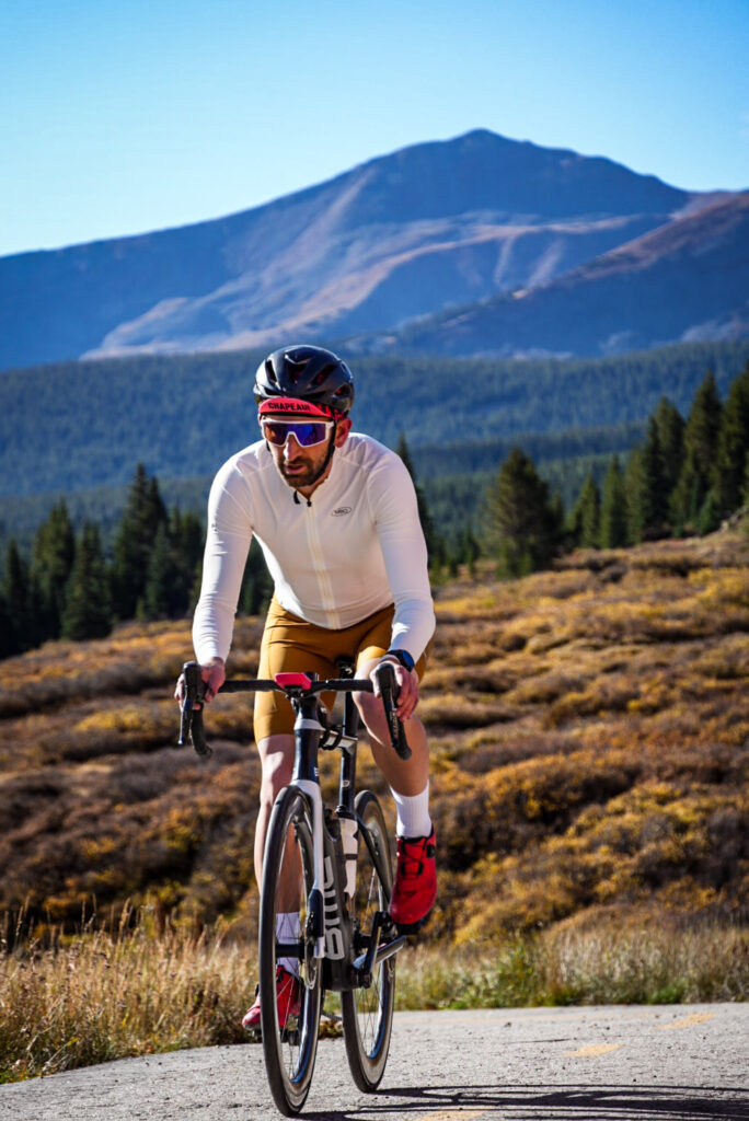 Cyclist riding up Vail Pass